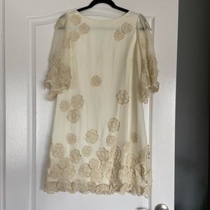 Soft white sack dress with tan floral appliqués